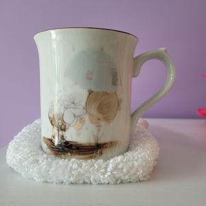 Precious Moments 1987 coffee cup.